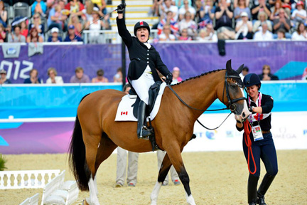Andrea Taylor assists Ashley Gowanlock, riding Maile, at the 2012 London Paralympic Games.